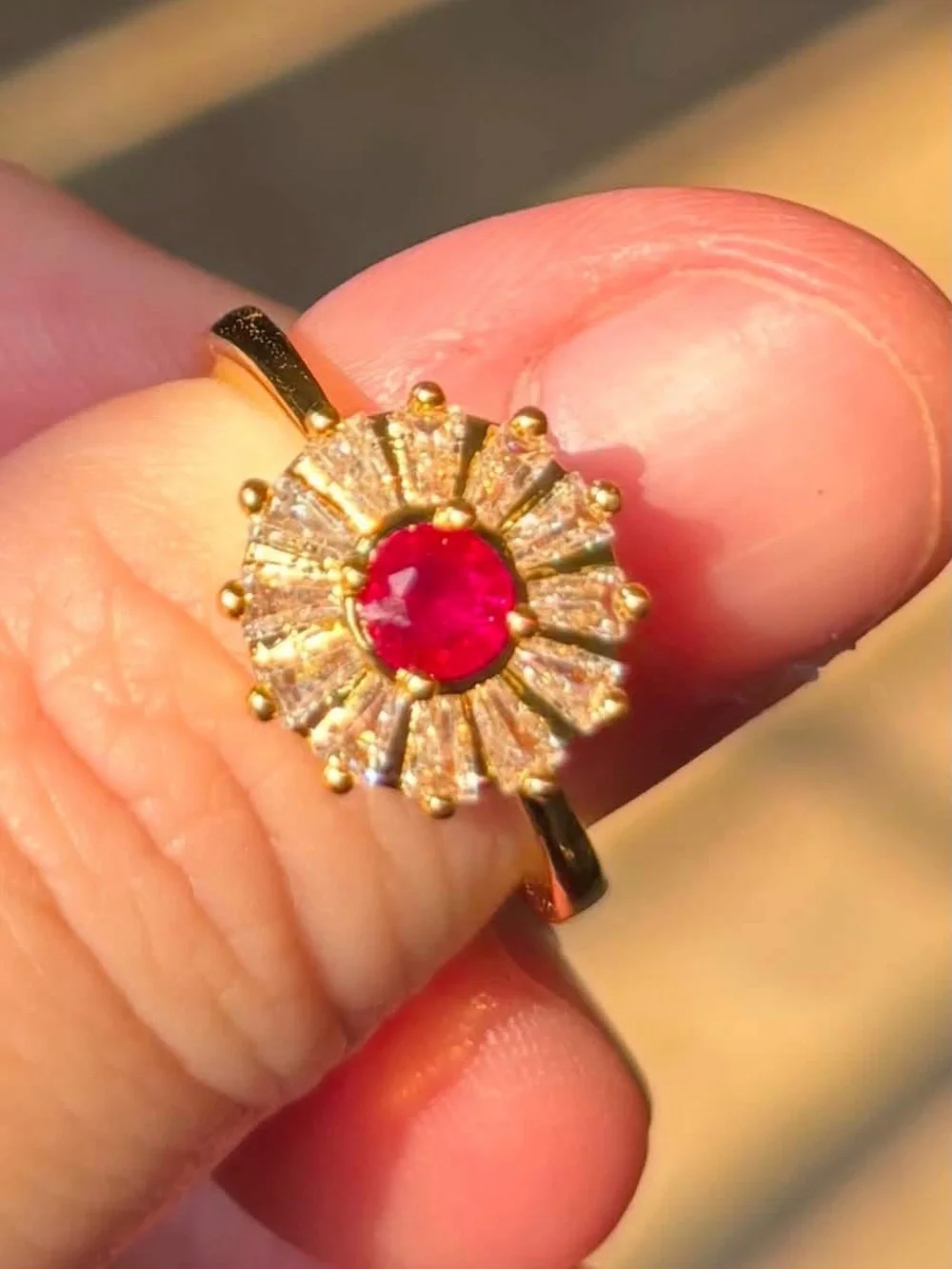 Gold Ring with Red Center Stone and Radiant Halo